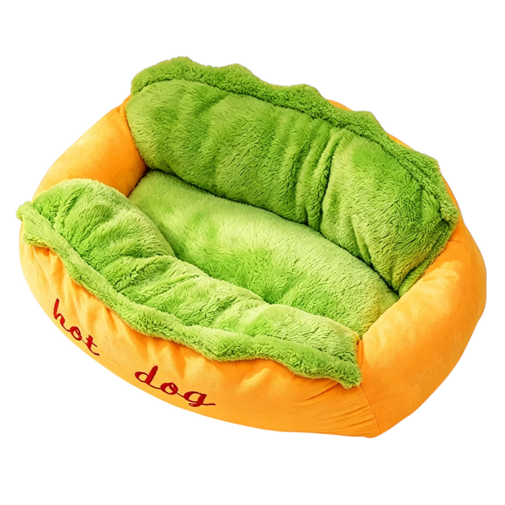 The Tailored Tail plush hot dog pet bed for small dogs and cats with a vibrant orange exterior and soft green interior