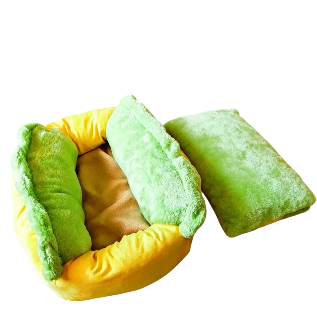 The Tailored Tail plush hot dog pet bed for small animals with a removable green cushion and soft yellow base