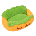 The Tailored Tail plush hot dog pet bed for small dogs and cats with a vibrant orange exterior and soft green interior.