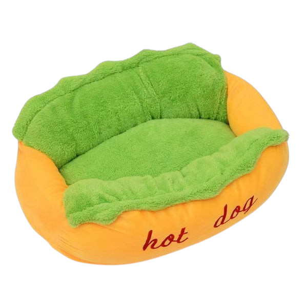 The Tailored Tail plush hot dog pet bed for small dogs and cats with a vibrant orange exterior and soft green interior.